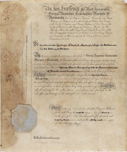 Discoloured parchment certificate with handwritten cursive text. Faded octagonal seal lower left corner.