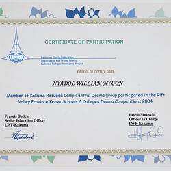 Rectangular white card certificate with blue, green black and gold printing.