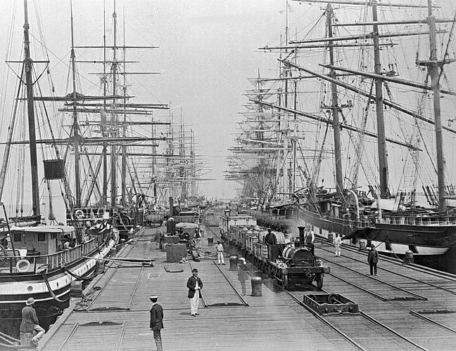 [Sailing ships and a steam train at Sandridge Pier, Port Melbourne, circa 1880.]