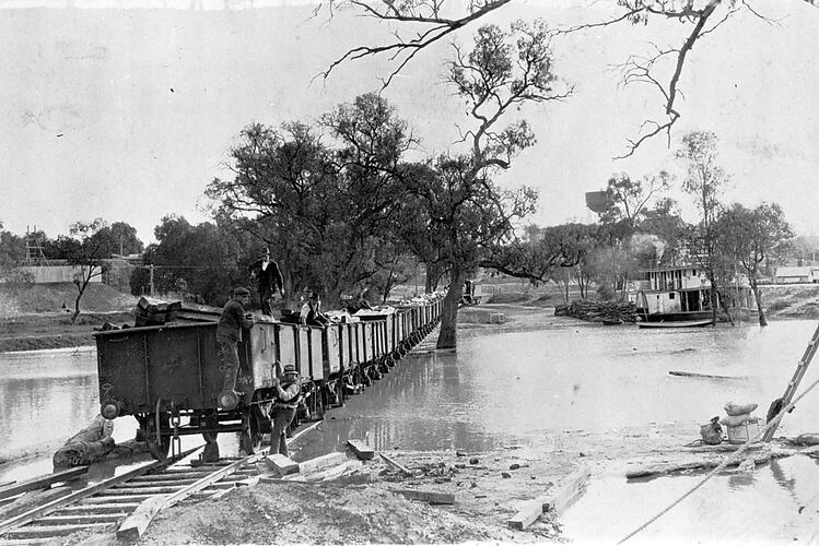 Train traversing flooded Murray River, Mildura, circa 1924.