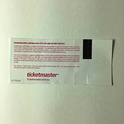 Back of white ticket with red printed text.
