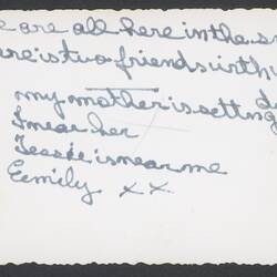 Back of photograph with handwritten text.