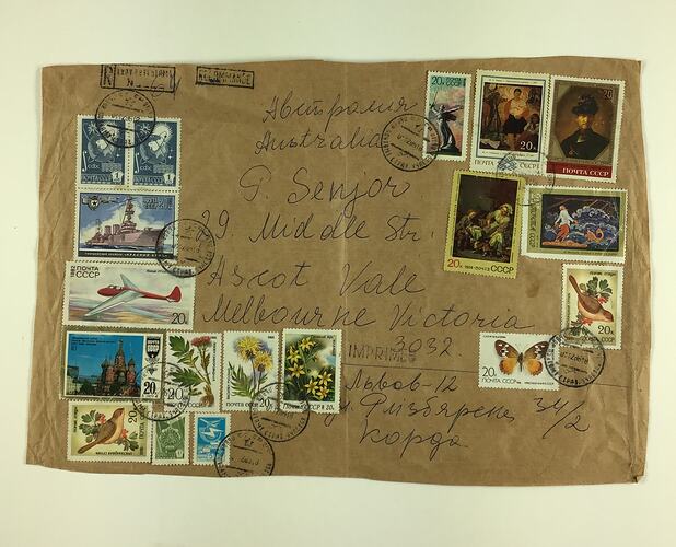 Large brown envelope, covered with Soviet stamps dating between 1973 and 1986. Handwritten address.