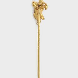 Gold stick pin with a small irregular gold nugget at the end.