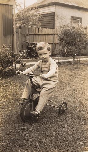 Digital Photograph - Boy Riding Tricycle in Backyard, Brighton Beach, 1948
