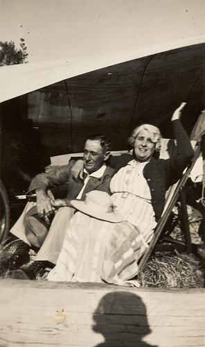Digital Photograph - Man & Woman Sitting Under Tarpaulin at Beach, Ricketts Point, 1939