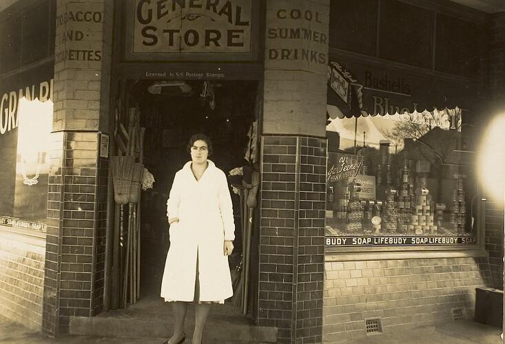 Digital Photograph - Girl Standing outside Father's Business, Feeney's Corner Store, Brunswick West, circa 1937