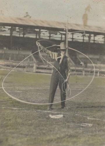 Digital Photograph - Holden Brothers Circus, Man in 'Cowboy' hat spinning a lasso in Showground, Royal Melbourne Show Ground, Ascot Vale, circa 1910