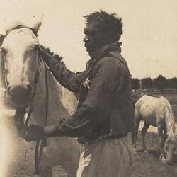 Digital Photograph - Holden Brothers Circus, Man with a Bridled Horse, circa 1910
