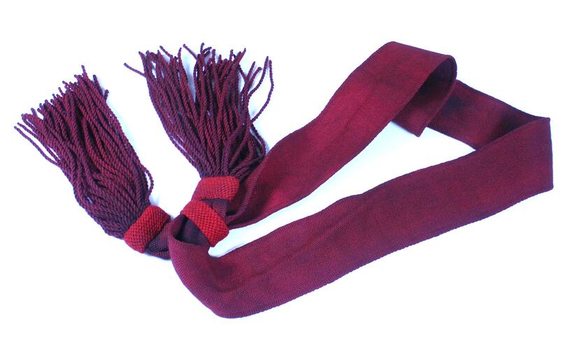 Red military sash, partially folded.