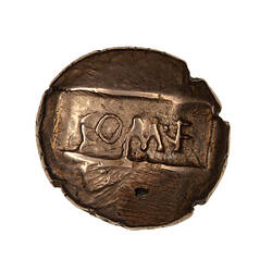 Coin, round, on sunken tablet, with text COM.F (translation, son of Commius).