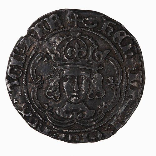 Coin, round, crowned bust of the King facing, the crown has the outer arch jewelled; text around.