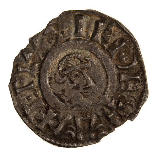 Coin, round, a diademed bust facing right, the base extends to the edge of the coin; text around.