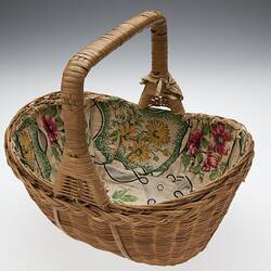 Basket with handle and cloth lining.