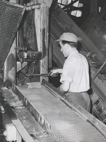 A man working a machine.