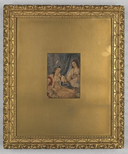 Painting of two women gossiping in a gold mount and frame.