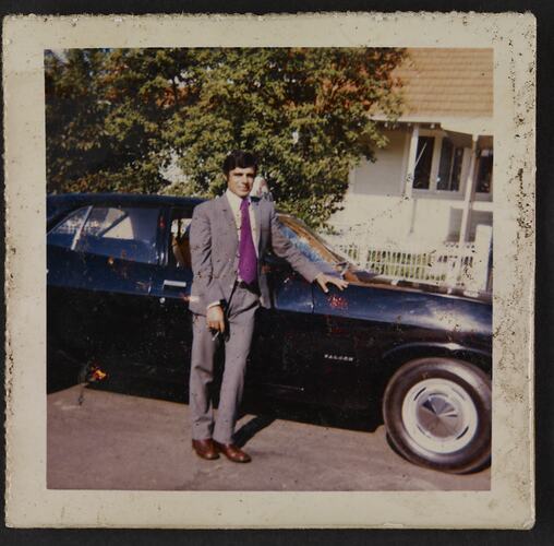 Portrait of man in front of a taxi