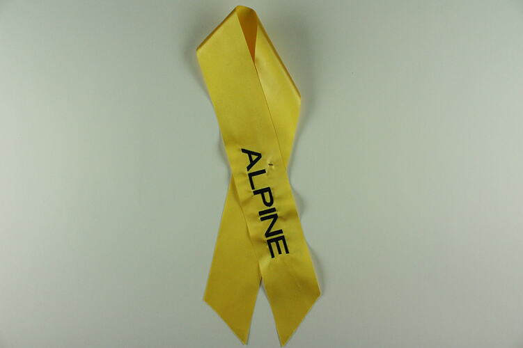 Yellow ribbon with Alpine written on it.