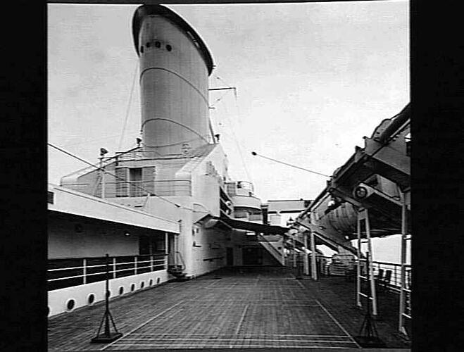 Onboard ship deck looking at funnel.