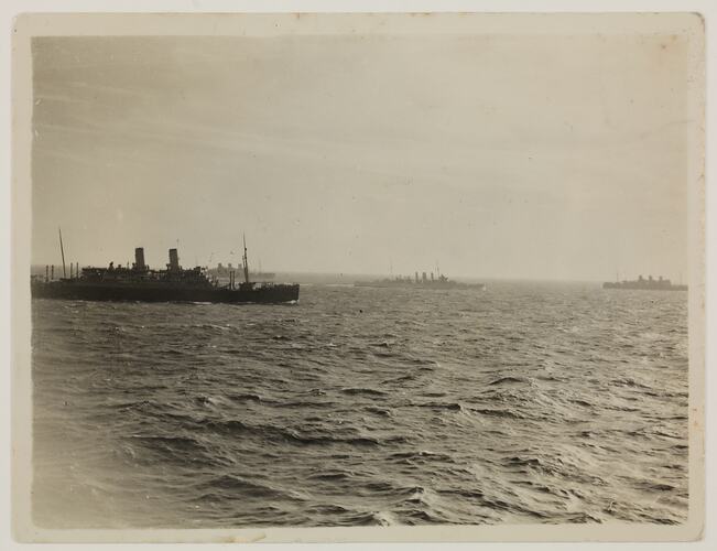 Four Navy ships at sea.