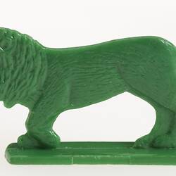 Green plastic toy lion.