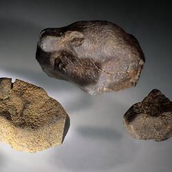 Three meteorite specimens.