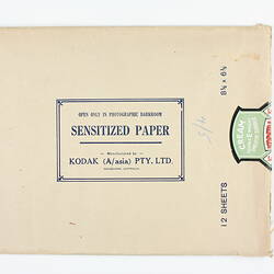 Brown paper packet with green product sticker.