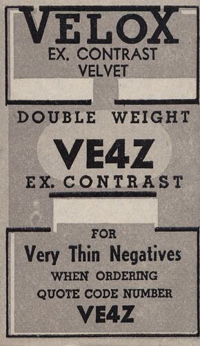 Grey paper label with printed black text.