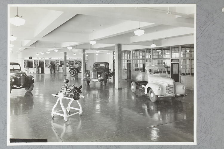 Monochrome photograph of a showroom interior.