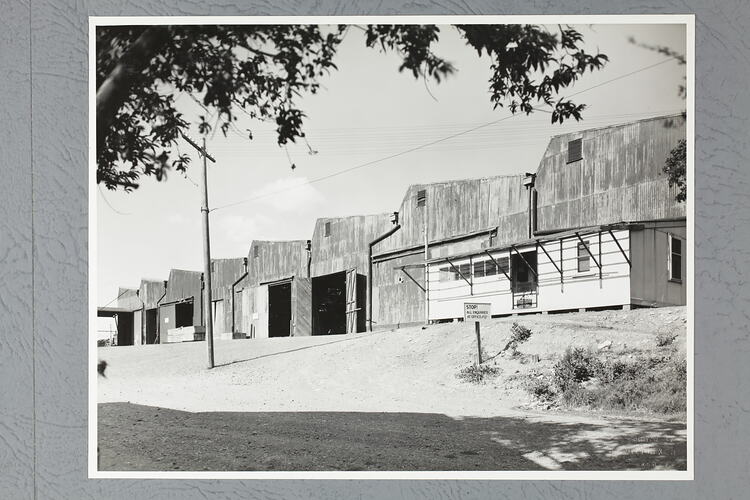 Monochrome photograph of a workshop.