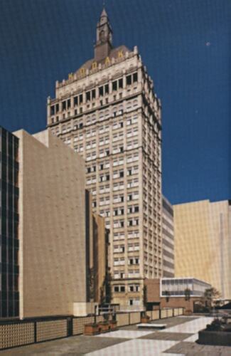 Postcard with photograph of highrise building.