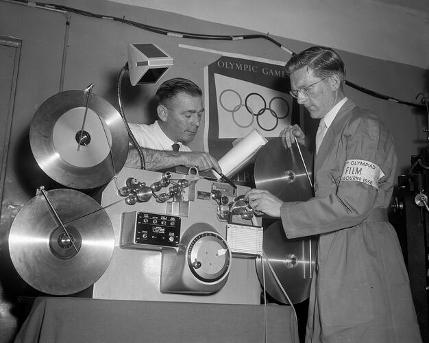 Two Men Loading a Film Projector, Melbourne, Victoria, 1956