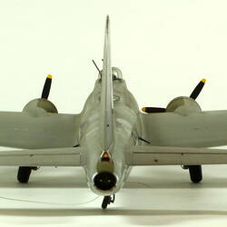Silver model aeroplane. Back view.
