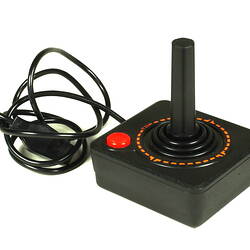 Black plastic joystick showing power cable.