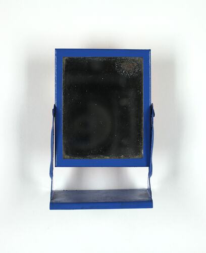 Front of toy standing mirror.