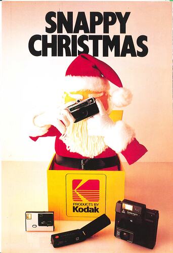 Cover page with Santa jack-in-the-box surrounded by cameras.