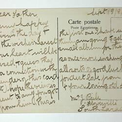 Printed postcard with handwritten text.