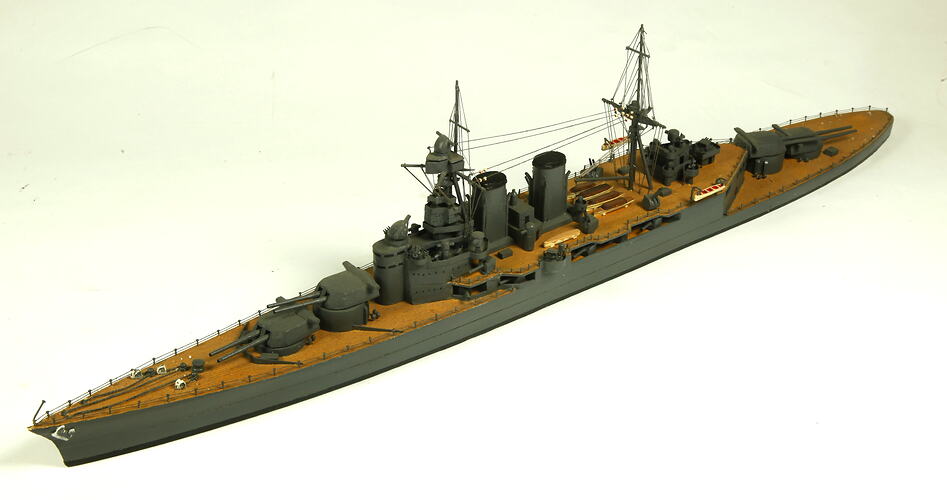 Naval ship with two masts, three quarter view.