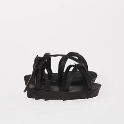 Black rubber miniature sandals.