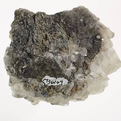 Underside of Calcite mineral showing registration number.