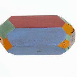 Wooden crystal model painted red, blue, green and orange.