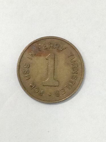 Round ferry transport token.