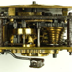 Internal mechanism of decorative table clock, square gilded brass case.
