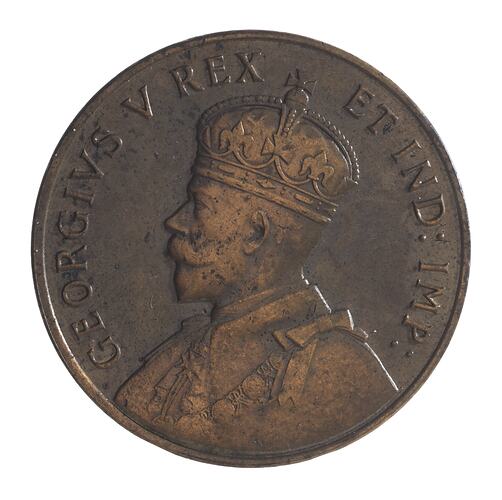 Round bronze-coloured medal with bust of King facing left, wearing crown and formal attire. Text around.