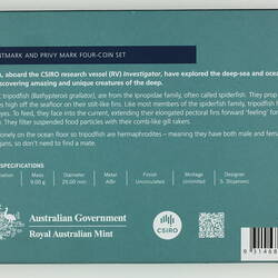 Back of blue/green card with white printed text.