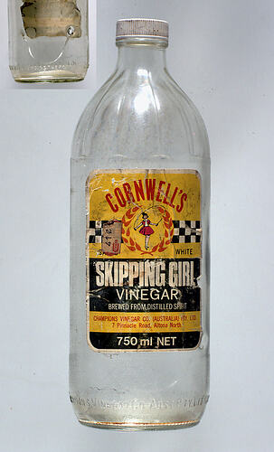Bottle with label showing girl skipping.