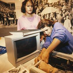 Digital Photograph - Lisa Williams & Odetta Moore assembling an Apple IIE, Sunrise School, Melbourne Museum, Russell Street, 1989