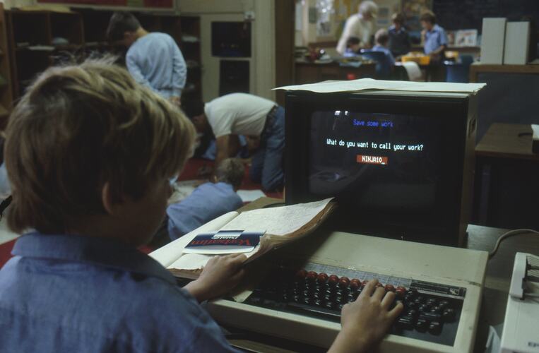 A classroom of students working on computers.