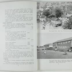 Open booklet with white pages and black printing. Houses on right page.