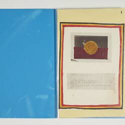 Open blue folder with white page on right. Has Aboriginal flag and printed text below.